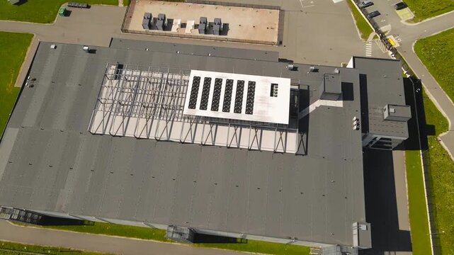 Aerial view of  a data center in sunny countryside for AI, Algorithms, data, Intelligent Systems, cryptography and security and quantum computing, Server space.

