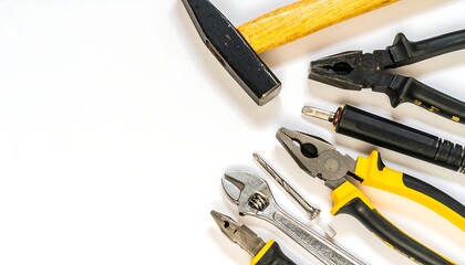 Assorted hand tools arranged on a white background, leaving ample copy space