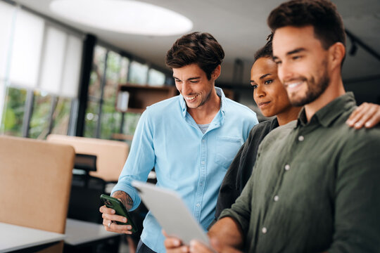 Group of busy happy diverse professional business team people working in office using digital tablet - Powered by Adobe