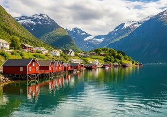 Fototapeta premium Picturesque norwegian village with red houses along a tranquil fjord