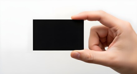 Obraz premium Hand Holding Blank Black Business Card Mockup on White Background