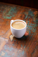 Cup of coffee on wooden background. Soft focus. Copy space	