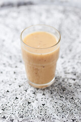 Pineapple coconut smoothie on bright background. Soft focus. Copy space.	
