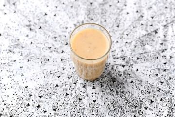 Pineapple coconut smoothie on bright background. Soft focus. Copy space.	