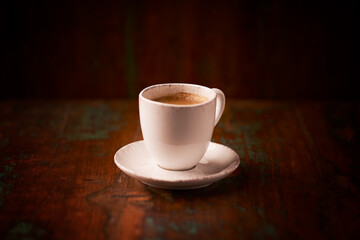 Cup of coffee on wooden background. Soft focus. Copy space	