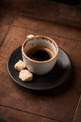 Cup of coffee on wooden background. Soft focus. Copy space	