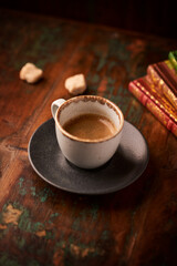 Cup of coffee on wooden background. Soft focus. Copy space	