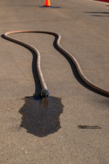 Length of firehose on the ground charged with water