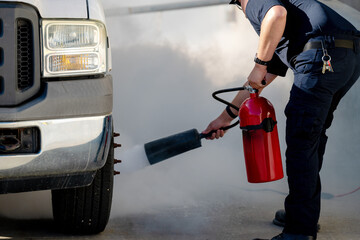 Fireman help to put out a truck fire