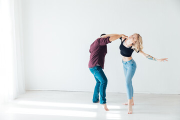 Man And Woman Dancing To Music In Room