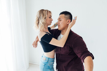 Man And Woman Dancing To Music In Room