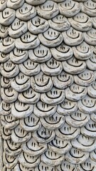 This is a picture of stucco scales belonging to a mythical creature from Asian belief, known as a Himmapan animal.