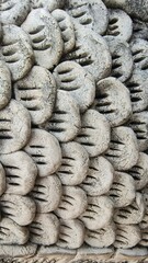 This is a picture of stucco scales belonging to a mythical creature from Asian belief, known as a Himmapan animal.