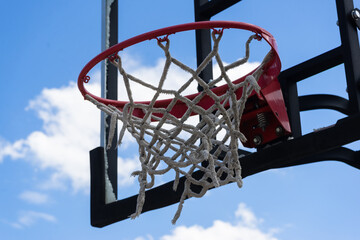 Basketball backboard that is broken, damaged, unusable.