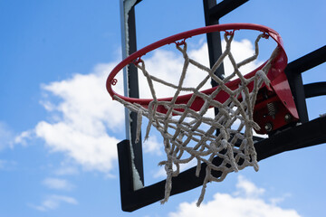 Basketball backboard that is broken, damaged, unusable.