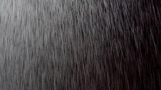 Heavy rain water drops through window with black background easy to blend in your composition by screen mode.