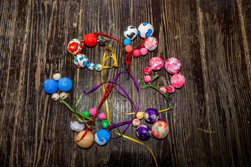 wooden painted beads, different sizes, painted, strung on multi-colored threads, bracelets, made by children, master class, creativity, art, close-up, handmade, decoration