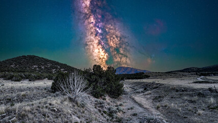 Colorful Milky Way core in Utah's rugged West Desert landscape in summer with air glow