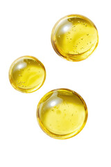 Three golden, glossy spheres, slightly translucent,  with subtle texture, floating against a black background