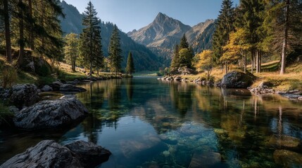Majestic mountain range reflected in a clear, calm lake surrounded by a lush green forest under a blue sky