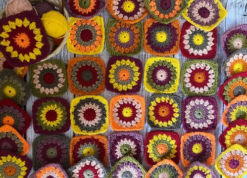 Granny square collection motives different colors flower decor crocheted samples handmade art photo	
