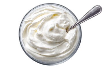 Creamy dairy product in glass bowl, topped with a spoon