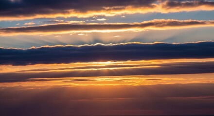Golden Sunbeams Pierce Through Dramatic, Layered Sunset Clouds