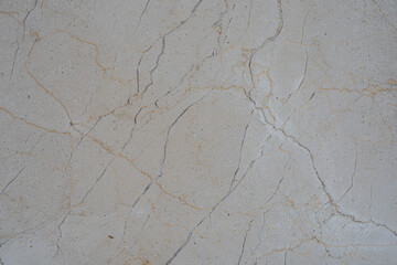 Textura de mármol beige con vetas grises y manchas naturales