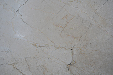 Textura de mármol gris con vetas naturales y grietas
