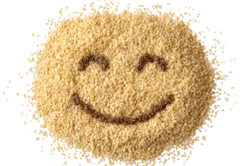 Pile of sesame seeds forming a happy face isolated on transparent background