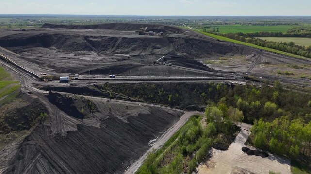 Drone Shot of a Mine Slag Heap with Working Machinery