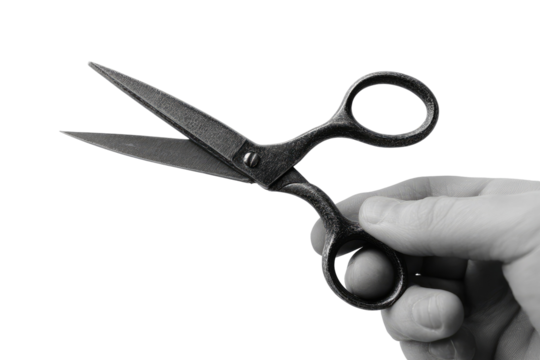 Close-up of a hand holding small metal scissors
