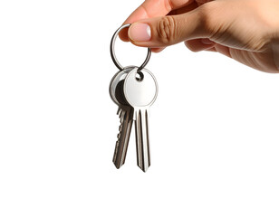 A human hand gently holds a set of shiny metal keys on a ring, symbolizing access or ownership.