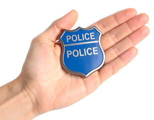 A human hand gently holds a blue shield emblem, representing law enforcement, security, and public safety.