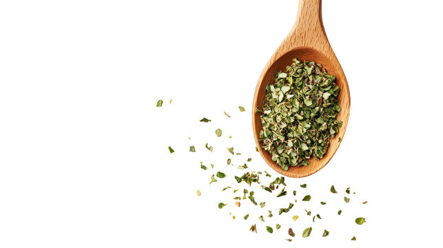 Chopped dry oregano falling from wooden spoon on transparent background