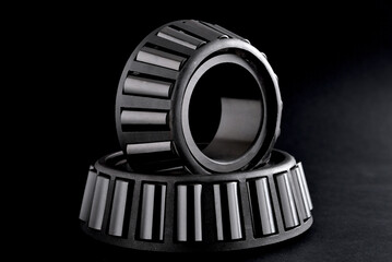 roller bearings on black background