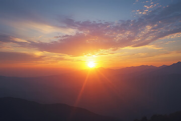Vibrant sunset over layered mountain ranges with dramatic sky