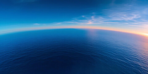 Obraz premium Vast Ocean Horizon Under Gradient Sunset Sky of Blue and Orange