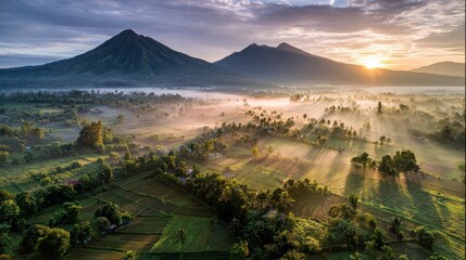 Sunrise over a valley of farmlands
