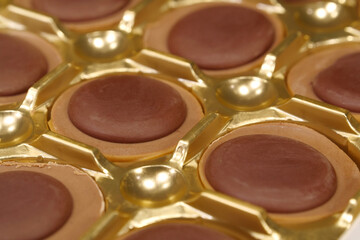 Delicious chocolate candies in packaging. Sweets