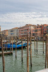 Gondolas moored along the Grand Canal with Venetian facades
