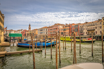 Gondolas moored along the Grand Canal with Venetian facades