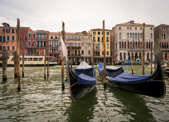Gondolas moored along the Grand Canal with Venetian facades