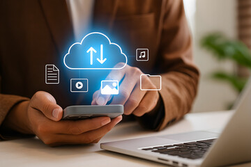 A person in a brown blazer using a smartphone with cloud computing symbols.