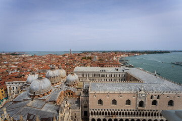 Aerial view of Doge’s Palace and Basilica domes with lagoon © Dreamnordno