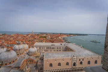 Aerial view of Doge’s Palace and Basilica domes with lagoon © Dreamnordno
