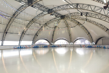 Winter, sport, architecture and leisure concept - ice skating rink indoors. Empty hockey field, arena with ice for product display, copy space