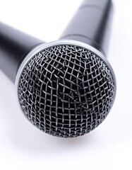 Close-up of two black microphones