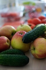 A Selection of Fresh Fruits and Vegetables Arranged on a Wooden Surface