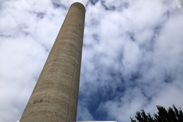 Amsterdam, The Netherlands - August 23rd, 2025 - Steam from the chimneys of waste incinerator AEB in Westpoort harbor